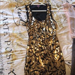 Black and gold sequin dress.